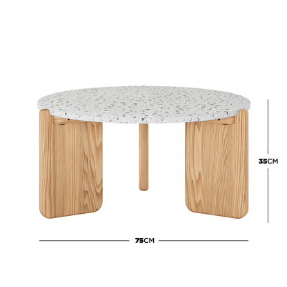 Everlee American Oak Coffee Table in Natural features a white terrazzo-style tabletop with speckled grey fragments, supported by three chunky, rounded rectangular solid wood legs. Dimensions: 75 cm diameter, 35 cm height.