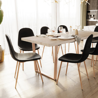Close-up of Florida Velvet Upholstered Dining Chairs (Set of 4) showcasing a luxurious velvet finish, sleek metal legs, and plush cushioning, arranged elegantly around a dining table for a stylish dining room setting.