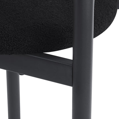 Gilles Boucle Arched Bar Stool Black Set of 2, featuring a sleek black cushion and sturdy metal frame, showcases modern elegance and ergonomic design for comfortable seating in contemporary dining spaces.