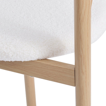 Gilles Boucle Arched Bar Stool Cream White Set of 2, featuring a close-up of textured wooden grain and cylindrical metal frame, showcasing luxurious boucle upholstery and ergonomic design for modern dining spaces.