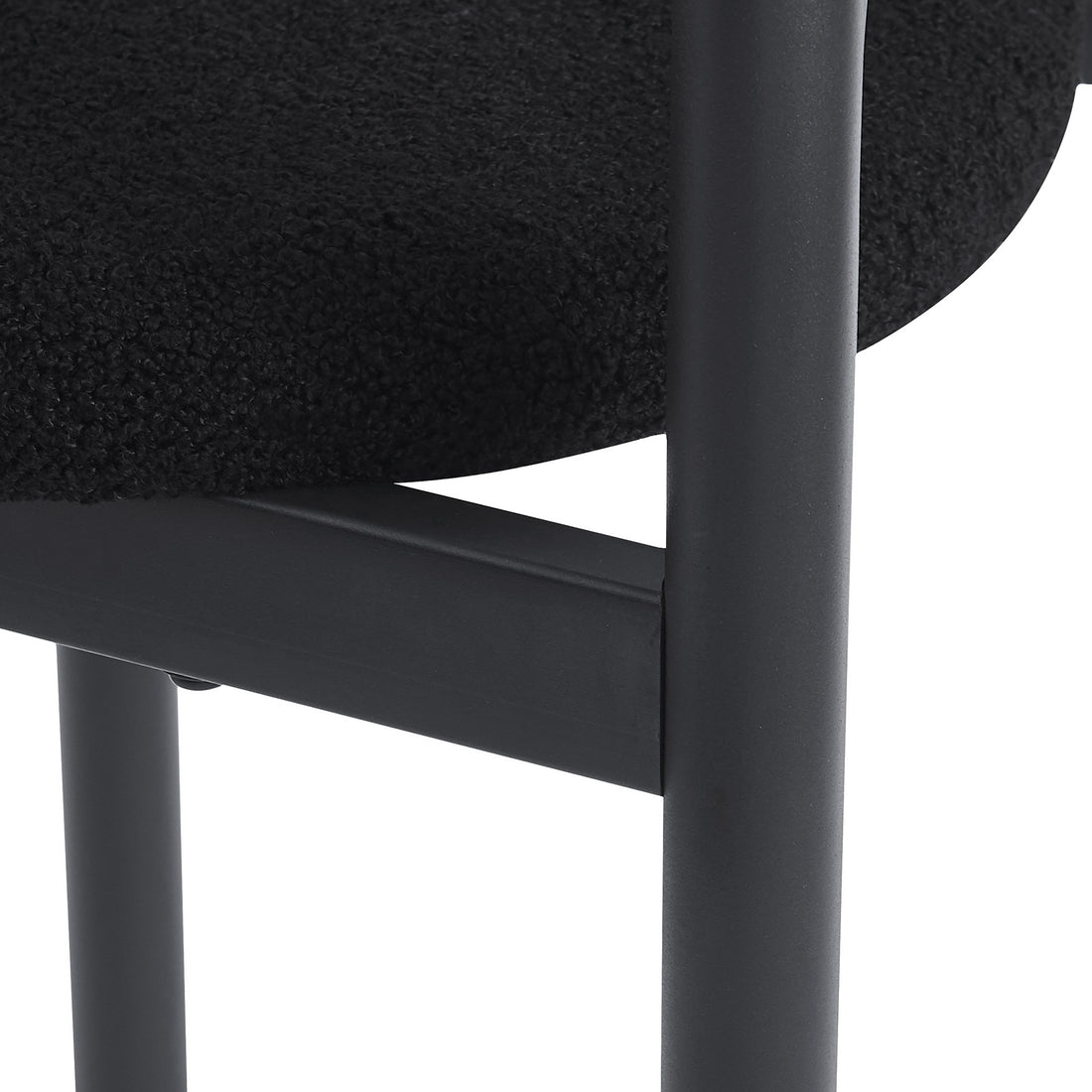 Gilles Boucle Arched Dining Chair Black Set of 2, featuring a sleek double-arched backrest and upholstered seats in luxurious boucle fabric, supported by a sturdy powder-coated metal frame.