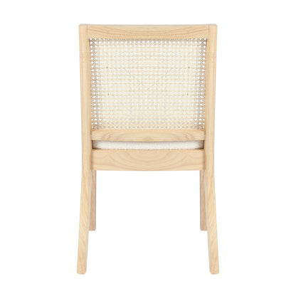 Rear view of Gretel Hardwood & Rattan Dining Chair Set of 2 in Natural, showcasing the woven cane backrest within a wooden frame, and the top edge of a lightly upholstered seat cushion.