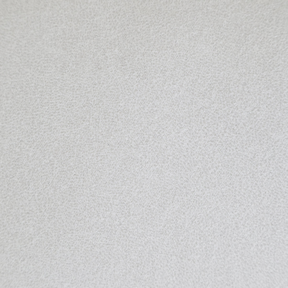 Close-up of flat light beige fabric showing a fine, uniform texture.   