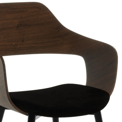 Close-up of the Kaylani & Winfield 5-Piece Wooden Dining Set, highlighting the chair's plush velvet armrest and the elegant wooden details, showcasing modern elegance and craftsmanship.