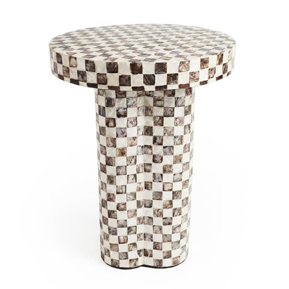 Modern round pedestal table with checkered pattern on white background