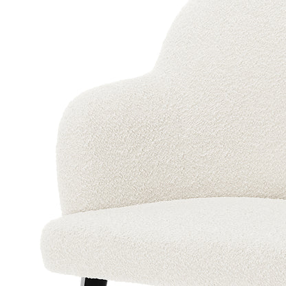 Close-up of the Lennon Bouclé Dining Chair Set of 2 in Cream White, showcasing its textured off-white bouclé upholstery and one visible black leg, highlighting modern elegance and comfort.