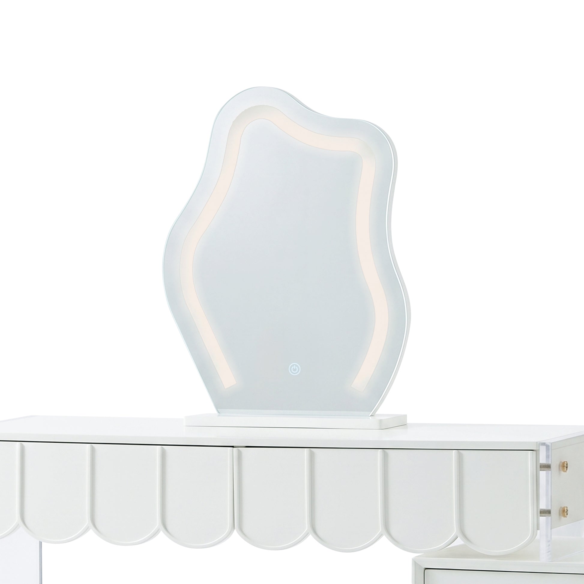 Wavy LED vanity mirror sitting on a white dressing table with a scalloped apron.
