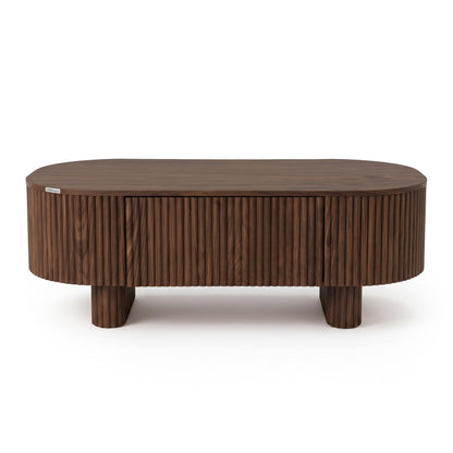 Modern oval wooden coffee table with vertical grooves on a white background