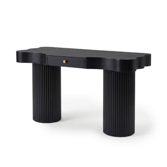Black console table with scalloped top and cylindrical fluted legs on a white background
