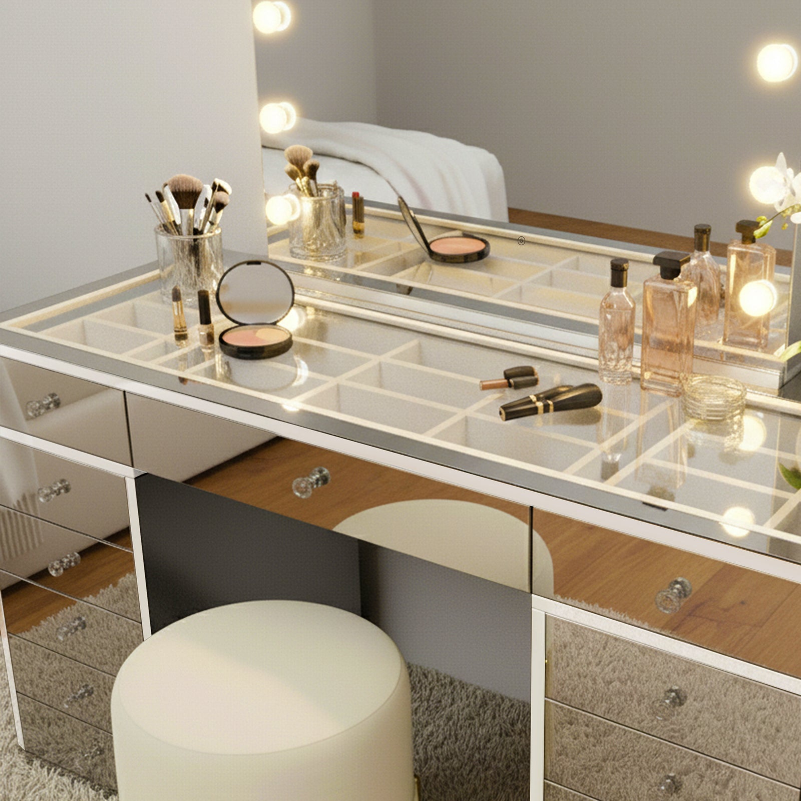 Monroe 13 Drawer Mirror Finish Hollywood LED Dressing Table with mirrored surfaces, makeup brushes, perfumes, and coasters, creating a glamorous, organized vanity setup with an ivory stool and plush rug.