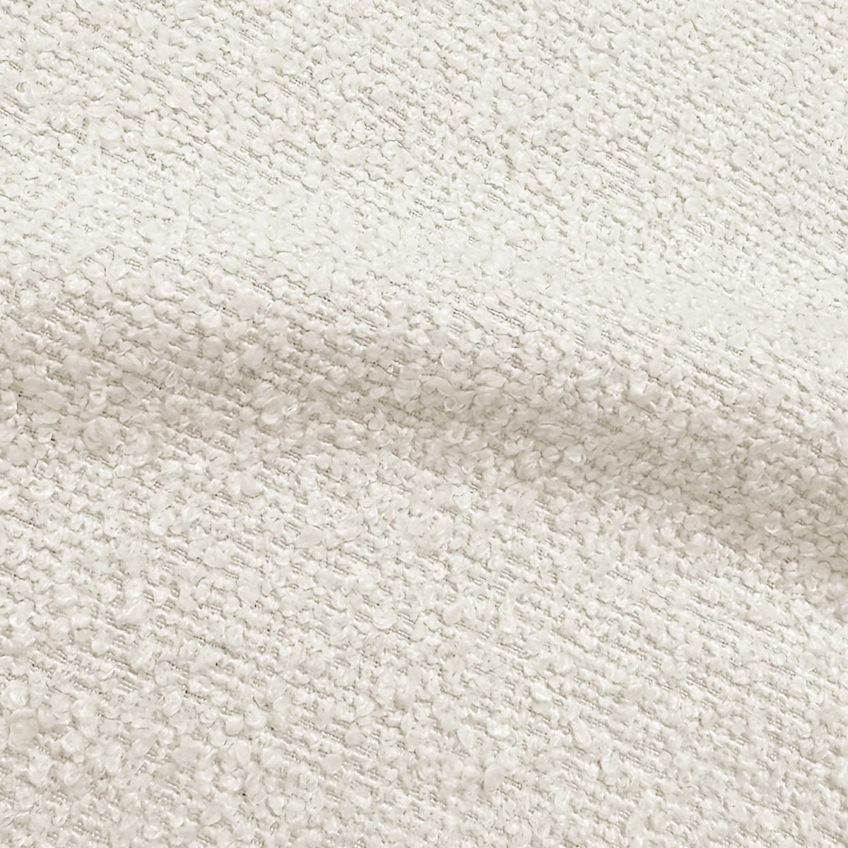 Close-up of textured cream bouclé upholstery fabric showing the soft, looped weave.   