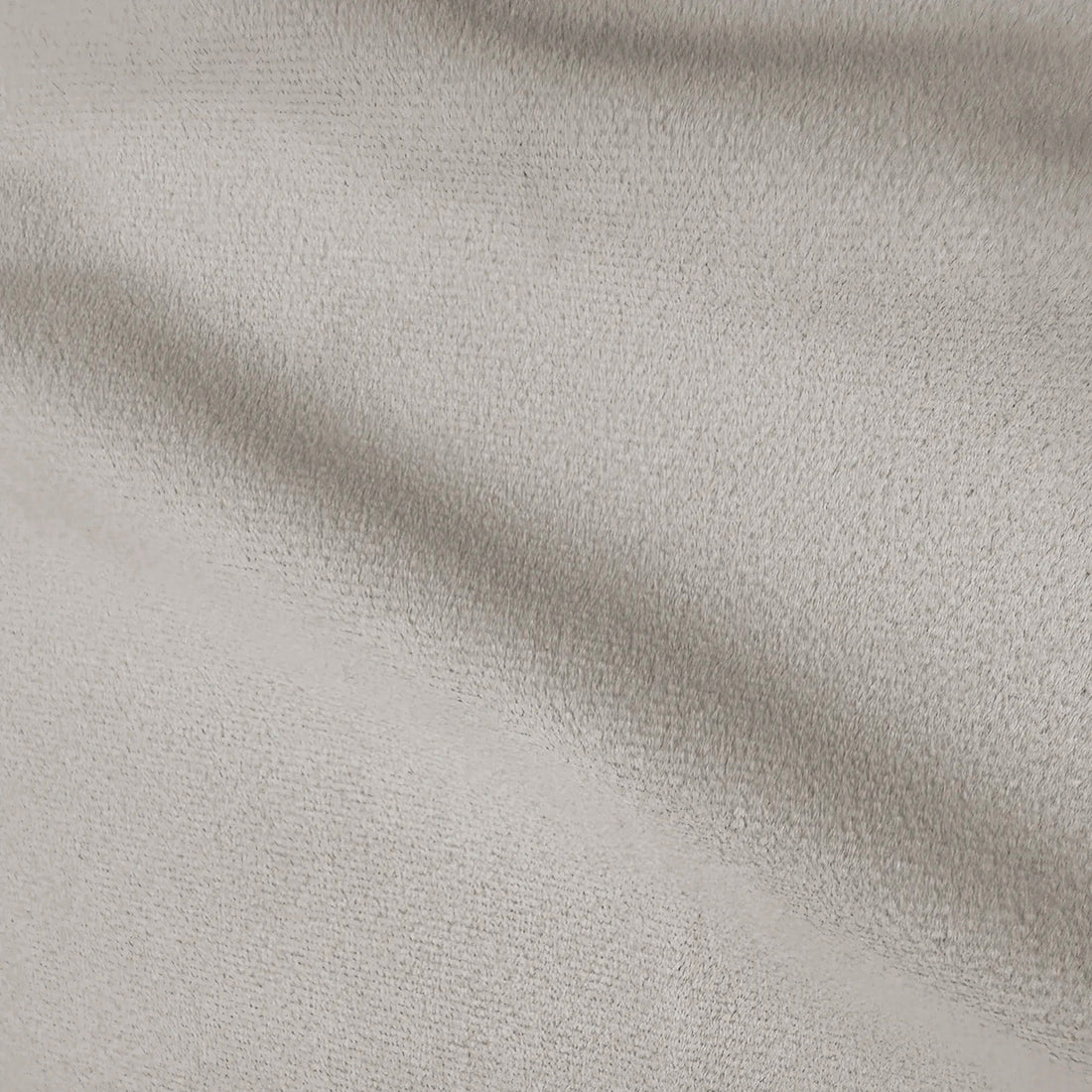 Close-up of smooth grey fabric upholstery with a soft, matte finish.   
