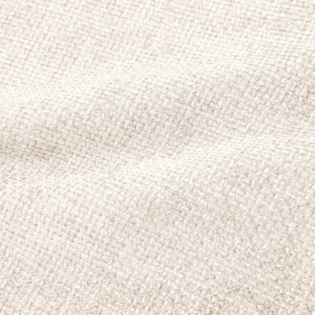 Close-up of textured warm ivory woven fabric highlighting its durable, cross-hatch pattern.   