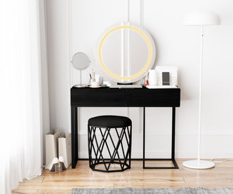 Ophira Dressing Table with Touch Screen Mirror Light – Black features a slim black table with two drawers, a glowing round LED mirror, and a geometric stool in a minimalist setting.