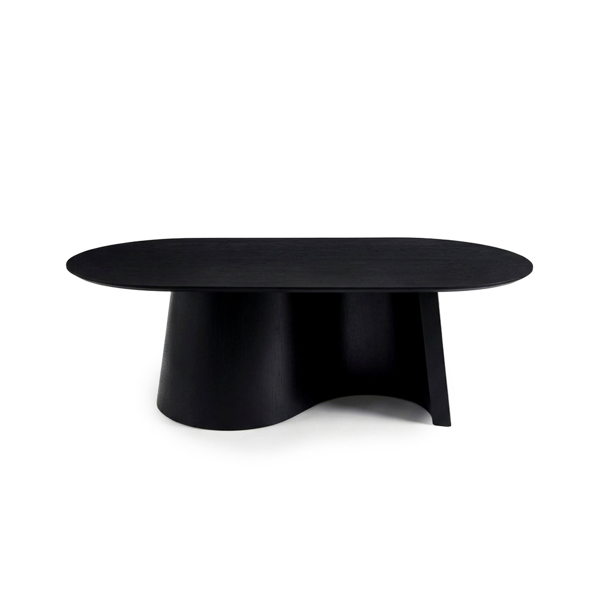 Full view of a black coffee table with oval top and sculptural curved base on a white background