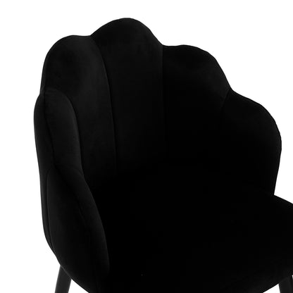 Sally Scalloped Velvet Dining Chair Set of 2 in Black, featuring a fluted backrest, low armrests, deep cushioned seat, and slim splayed legs, offering modern elegance and comfort.