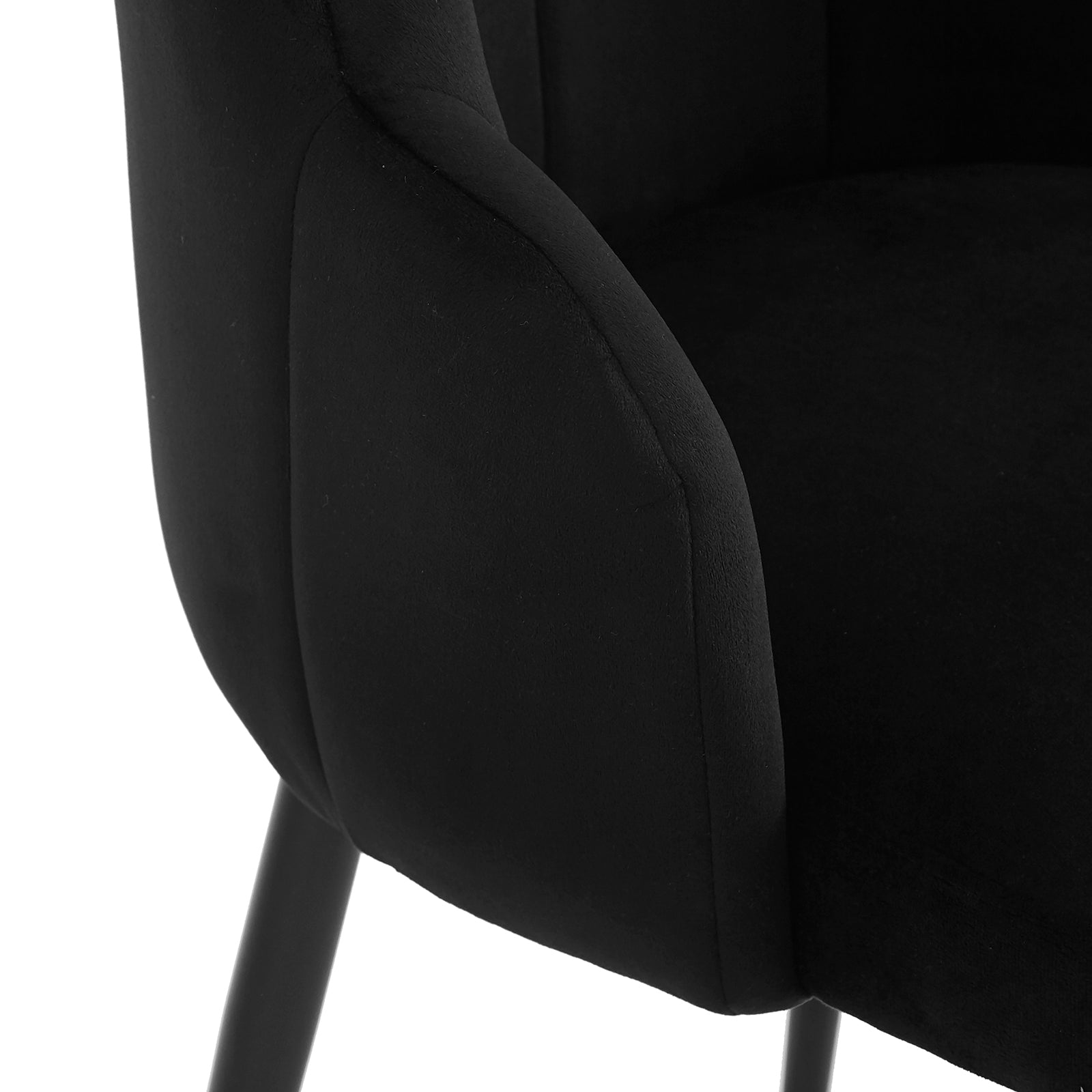 Sally Scalloped Velvet Dining Chair Set of 2 in Black features a modern design with a velvety soft fabric, curved armrest, plush seat cushion, and slim black legs for a sleek look.