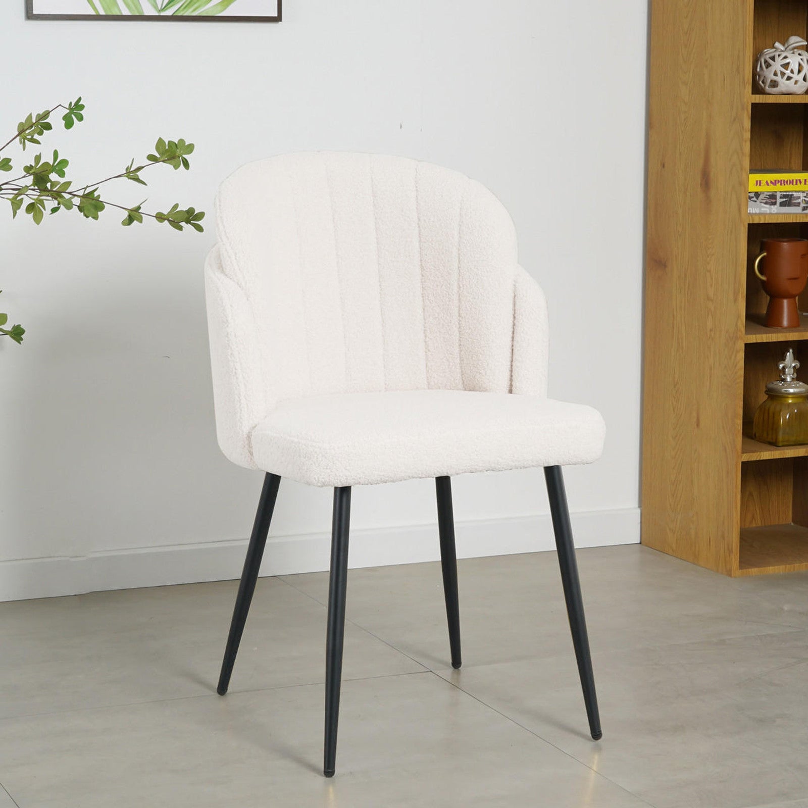 Scarlett Boucle Dining Chair Set of 2 in Cream White, featuring a curved scalloped back, plush boucle fabric seat, and slender matte-black metal legs, set in a minimalist room for elegant dining ambiance.