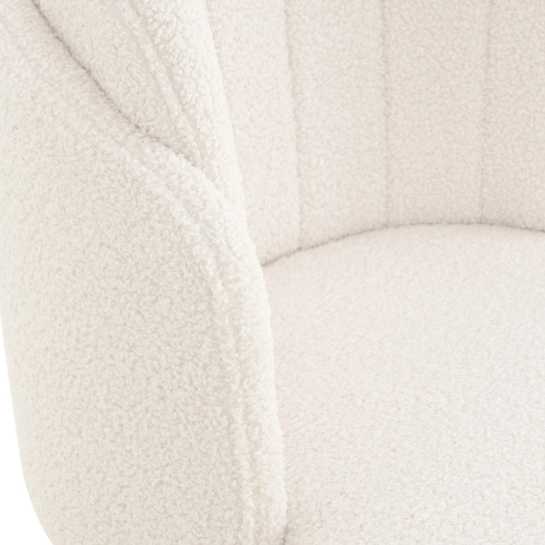 Scarlett Boucle Dining Chair Set of 2 in Cream White, showcasing the chair's soft, nubby boucle fabric on its curved back, armrest, and seat, highlighting its elegant and textured surface.