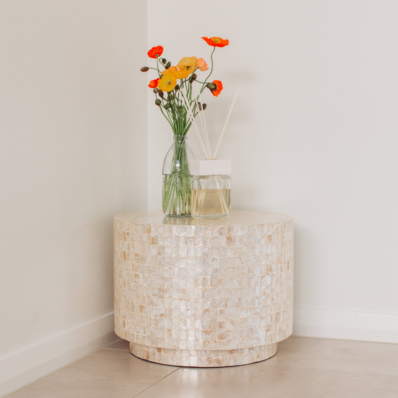 Tiffany 48cm Mother of Pearl Inlay Side Table Cream with intricate floral design, showcasing hand-crafted mother-of-pearl mosaic inlay, elegantly displayed in an indoor setting with a vase of flowers.