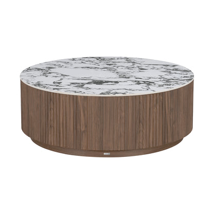 Round coffee table with wood veneer cylindrical base and white marble-look top on white background