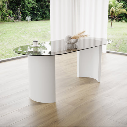 Zora 200cm Round Tempered Glass Oval Dining Table featuring a sleek glass top and stylish engineered wood legs, positioned elegantly on a glass surface, enhancing any modern dining space.