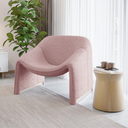Aaralyn Boucle Accent Chair in Dusty Pink displayed in a minimalist room, showcasing its modern design with soft boucle fabric and sturdy wooden frame, offering an inviting, plush seating experience.