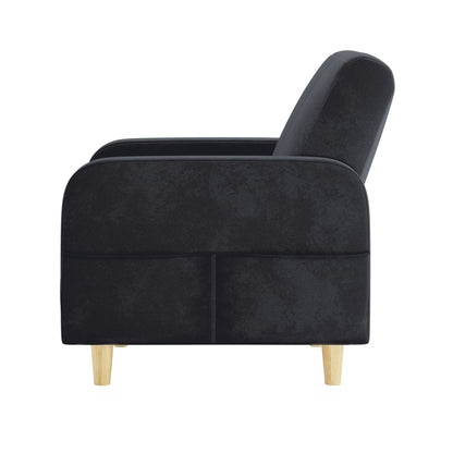 Side view of the Anica 6 Seater Velvet Fabric Sofa Bed Set in Black, featuring a mid-century-style armchair with black upholstery, a sloped backrest, squared armrest, and tapered light wood legs.