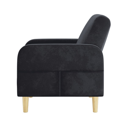 Anica Single Seater Velvet Sofa Chair in Black, featuring a modern design with rounded armrests, sloped backrest, and light-wood tapered legs, offering stylish comfort for living or bedroom spaces.