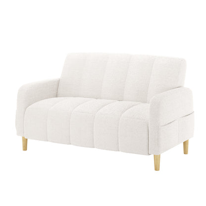 Anica 2 Seater Boucle Fabric Sofa Bed in Cream White, featuring a light off-white boucle upholstery, tufted seat and back, rounded arms, and short tapered wooden legs, offering versatility and style.