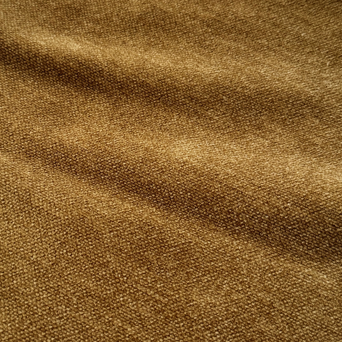 Close-up of the Arlo Chenille 360° Swivel Accent Chair in Amber Brown, showcasing its soft, textured chenille fabric and detailed nap, exemplifying its luxurious comfort and modern design.