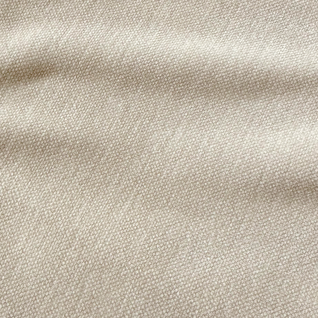 Close-up of the Arlo Chenille 360° Swivel Accent Chair in Oatmeal, showcasing its cream-beige, pebble-grain textured upholstery, embodying tactile luxury and contemporary style.