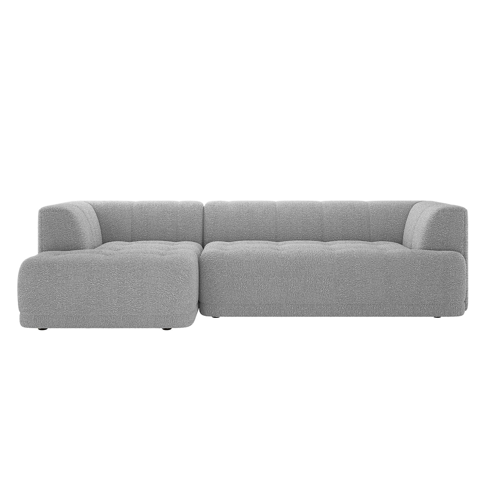 Averill 4 Seater Bouclé Fabric Chaise Sofa in Grey, featuring a modern L-shaped design with a left chaise, tufted seat detailing, and rounded edges in light gray textured fabric.