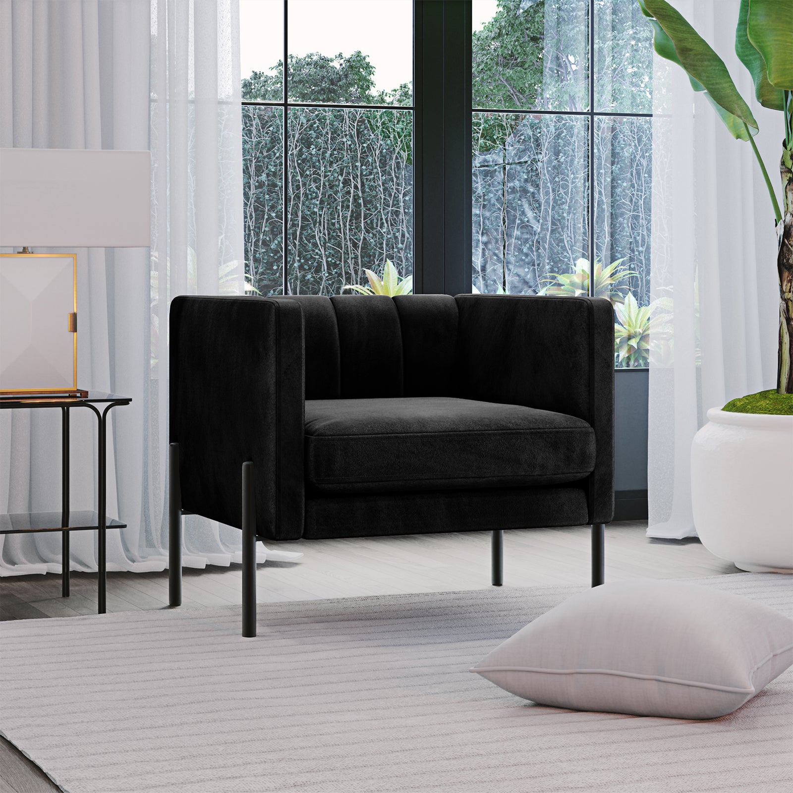 Avian Velvet Accent Sofa with Steel Legs in Black, featuring a boxy shape, channel-tufted back, and slender metal legs, set in a contemporary living-room with a modern decor.