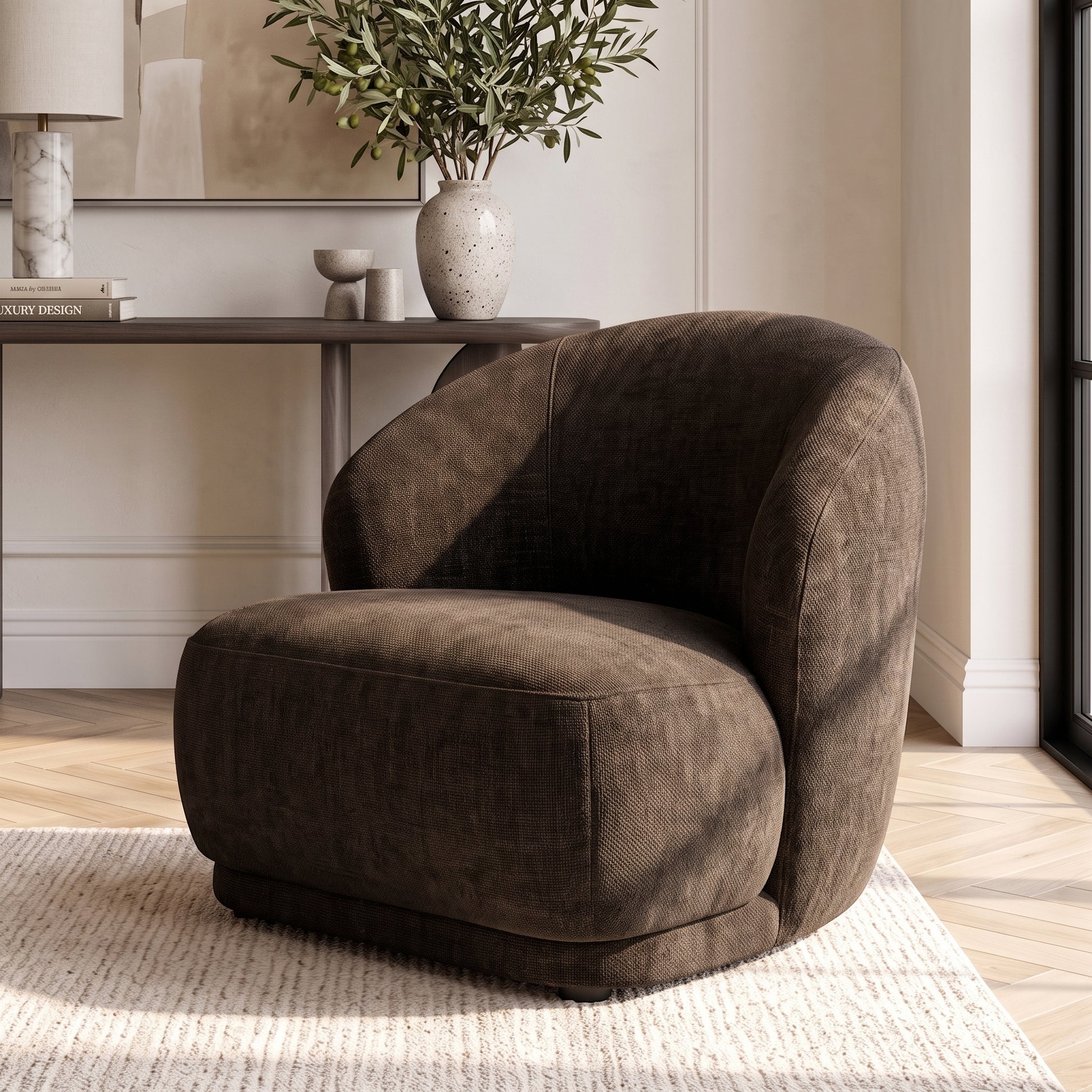 Cocoa brown accent chair placed in a stylish room with decor and a rug.