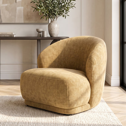 Mustard gold accent chair styled in a bright living room.