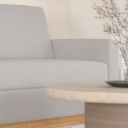 Close-up of the Celeste 3 Seater Hardwood Fabric Sofa, showcasing its eucalyptus hardwood frame, rubber wood legs, and removable cushions, emphasizing comfort and durability for a modern living room.