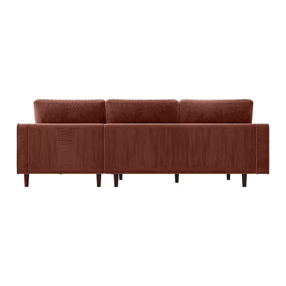 Claude 3 Seater Velvet Sofa with Chaise – Blush, showcasing a close-up of plush velvet fabric and wooden legs, highlighting its luxurious design and spacious chaise for ultimate comfort.