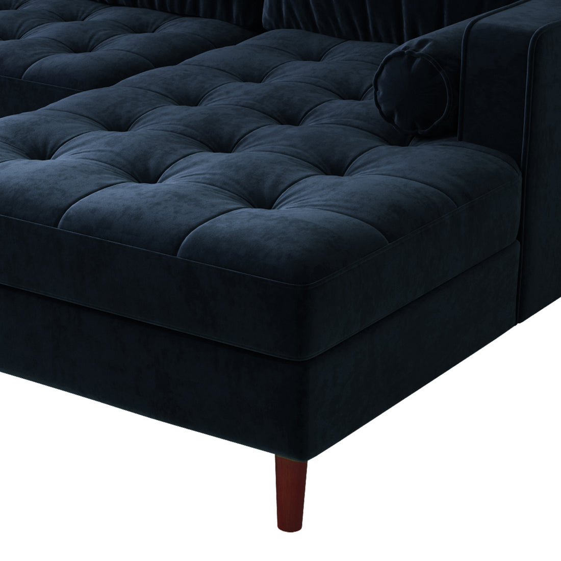 Close-up of the Claude 3 Seater Velvet Sofa with Chaise, highlighting its plush cushions, velvet texture, and sturdy wooden legs, showcasing its luxurious and comfortable design for modern living spaces.