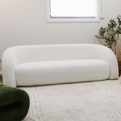 Lifestyle image of Clioz Bouclé 4 Seater Curved Lounge Package Eggshell White