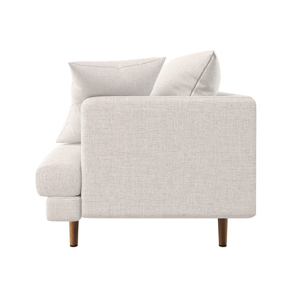 Side view of the Colton Living Room Package in Cream White, showcasing a modern two-seat sofa with light-beige woven fabric, matching cushions, and slender wooden legs for a mid-century-inspired aesthetic.