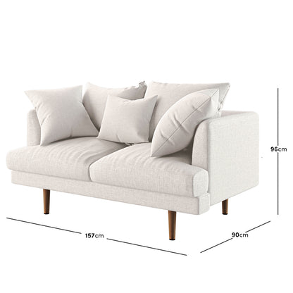 Modern Colton 2 Seater Fabric Sofa with Rug - Cream White, featuring cream upholstery, square armrests, walnut wooden legs, and styled with four throw pillows. Ideal for contemporary living spaces.