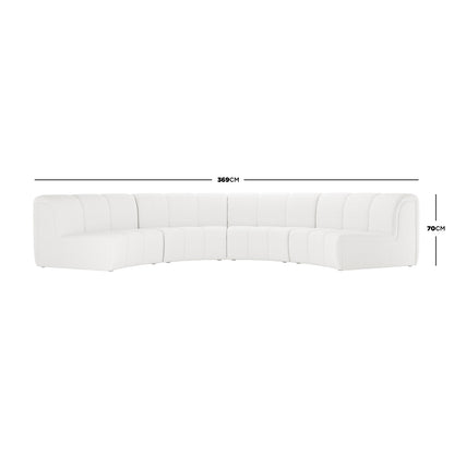 Corina 4 Seater Modular Boucle Sofa in Cream White features a modern, low-profile design with vertical channel tufting and a gentle arc, showcasing its modular segments and plush bouclé upholstery.