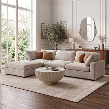 Light beige sectional sofa styled in a modern living room