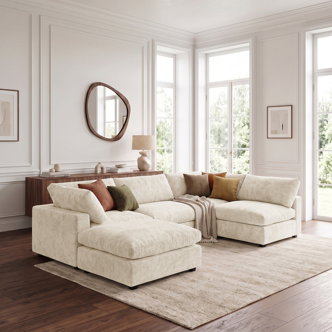 Light beige sectional sofa with ottoman in a bright living room