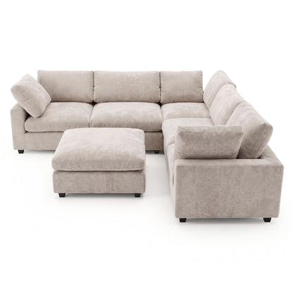 A modular corner sofa in a light taupe, plush fabric, featuring deep seats, comfortable back cushions, and a matching square ottoman positioned in front.