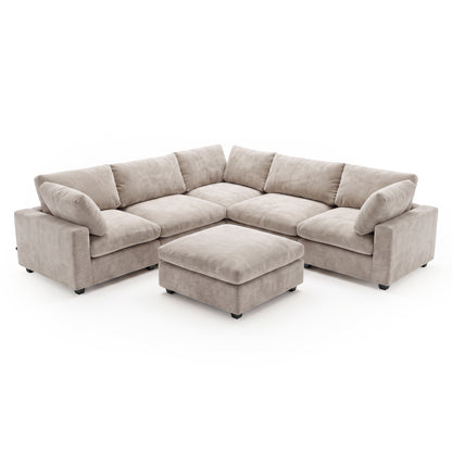 A modular corner sofa in a in Soft Greige, plush fabric, featuring deep seats, comfortable back cushions, and a matching square ottoman positioned in front