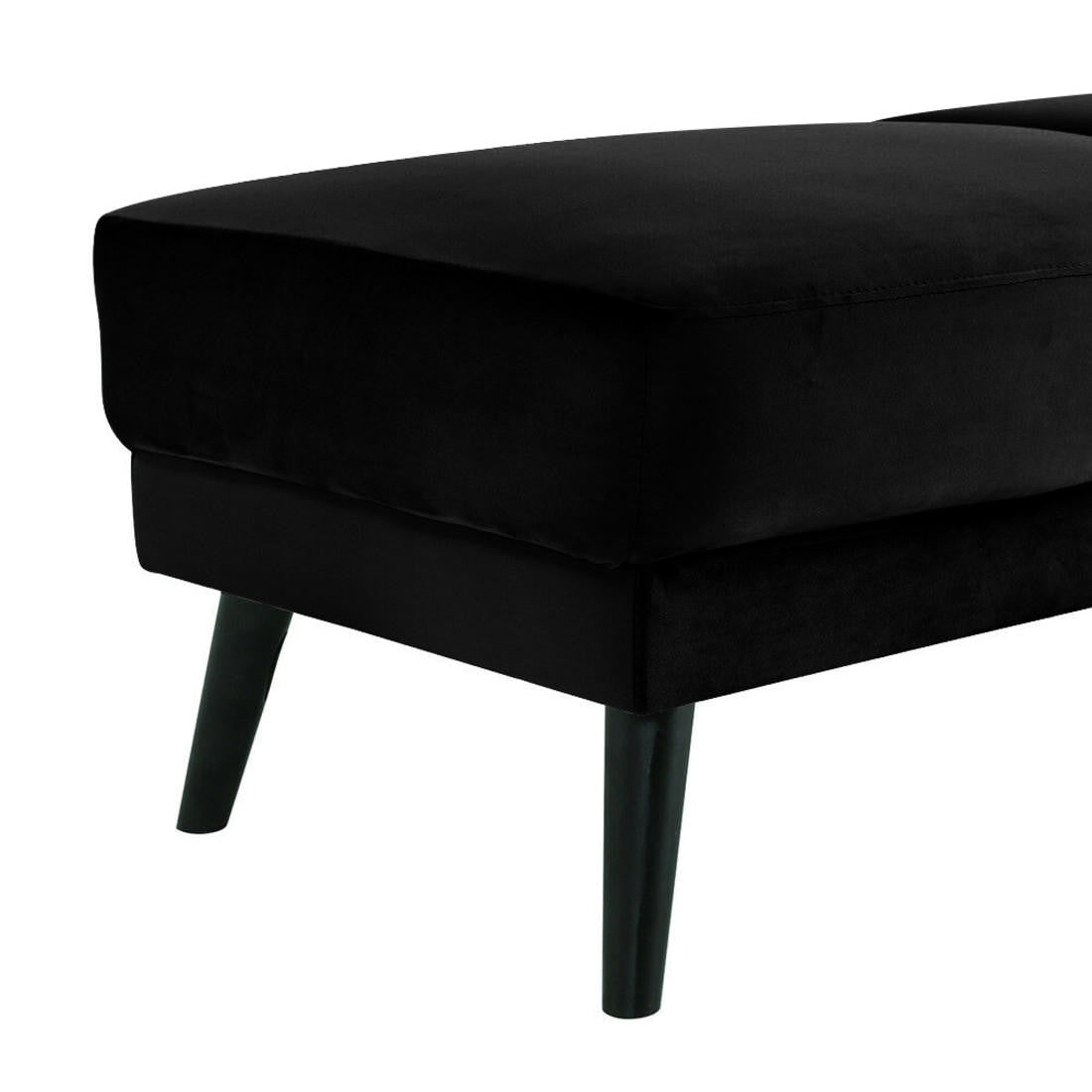 Esben Velvet Fabric Ottoman in Black, featuring a plush, padded top and slender, tapered wooden legs, offers a modern and luxurious addition to any living space.