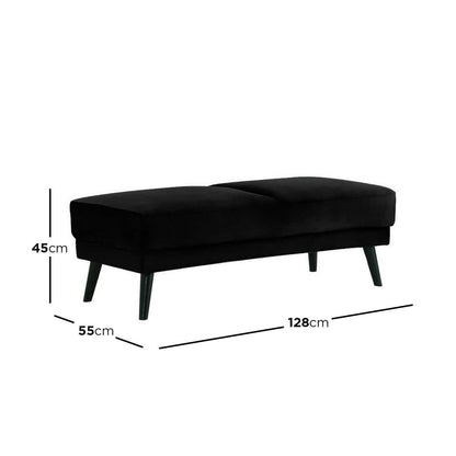 Esben Velvet Fabric Ottoman in Black, features a low, rectangular design with a cushioned seat, mounted on four slightly splayed wooden legs. Measures approximately 128 cm wide, 55 cm deep, 45 cm tall.