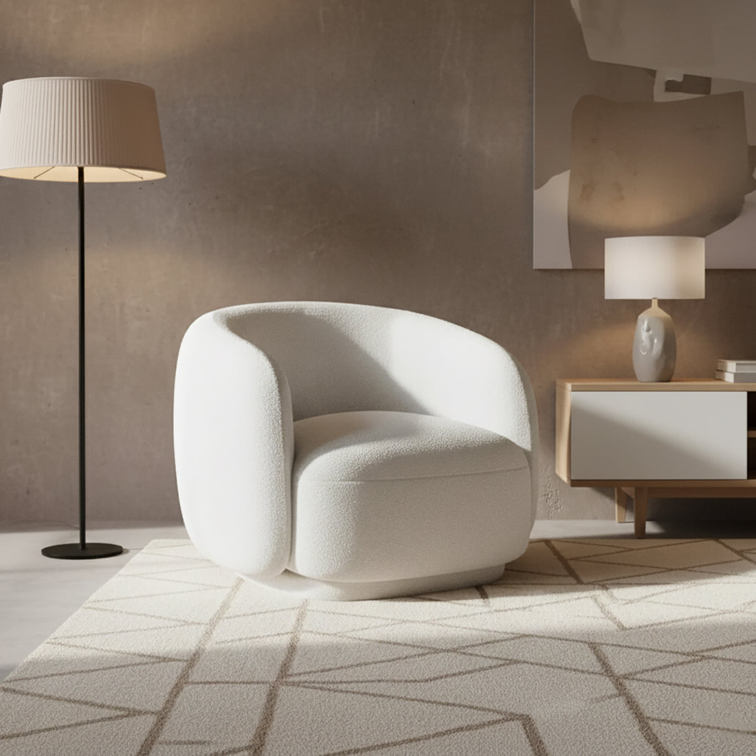 Janelle Bouclé Curved Accent Chair in White, featuring a rounded design, premium bouclé upholstery, and placed on a geometric-patterned rug, alongside a black floor lamp and a light wood side console.